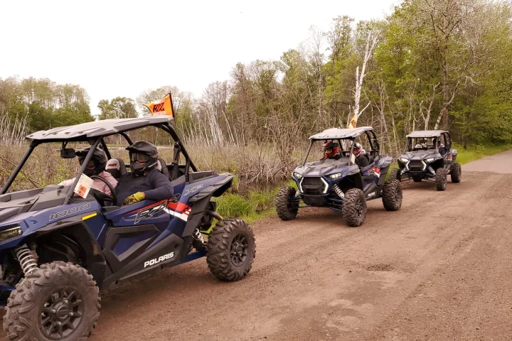 a motorcycle parked on a dirt road