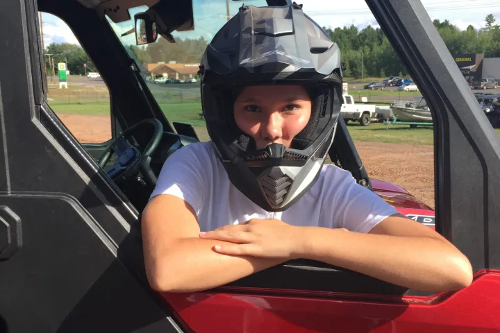 a person sitting in a car