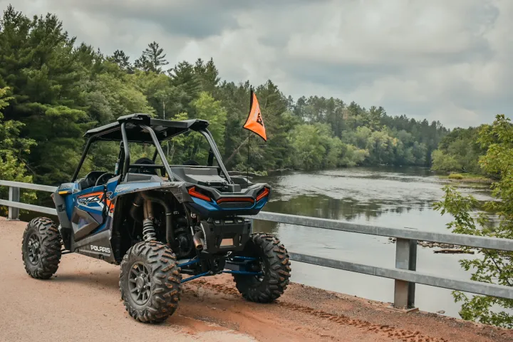 a person riding a bike down a dirt road