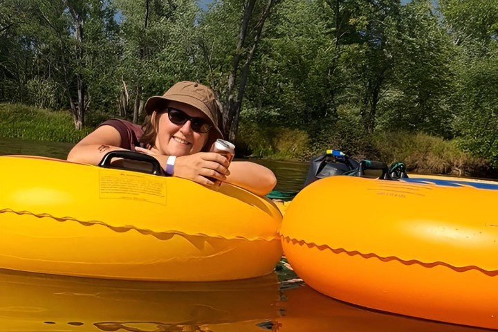 a person sitting on a tube