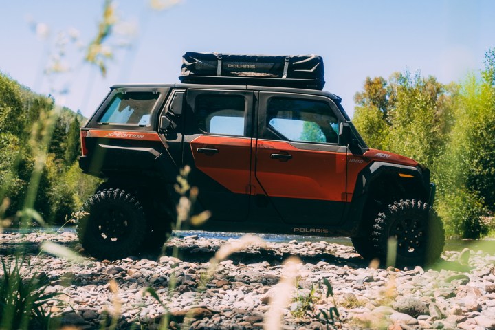 a utv driving down a dirt road