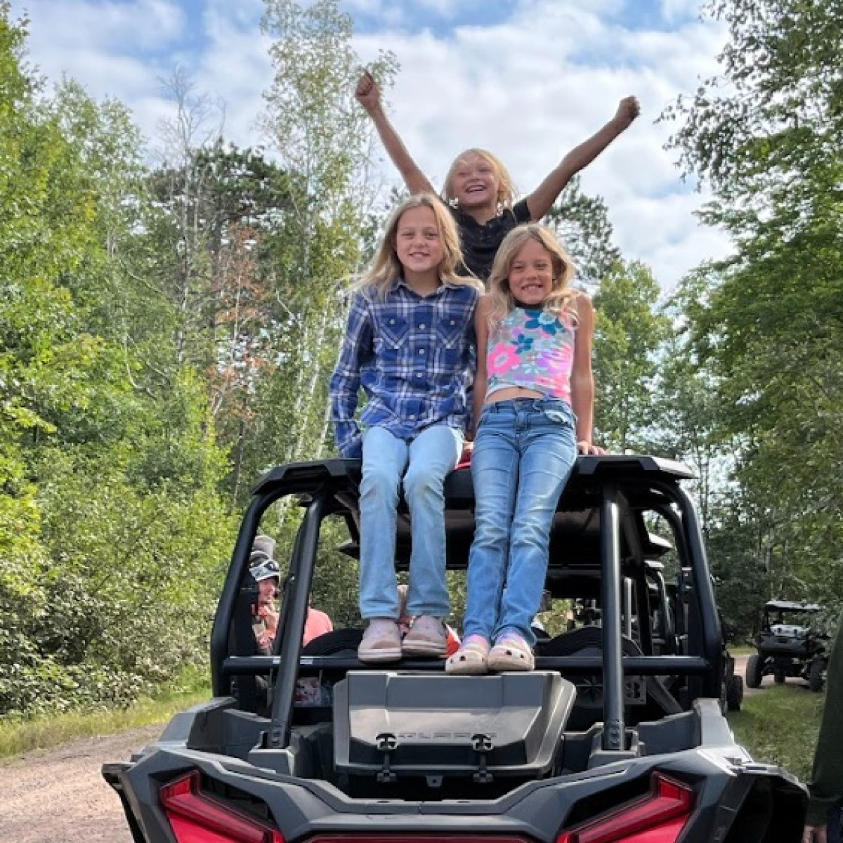 a person riding on the back of a truck