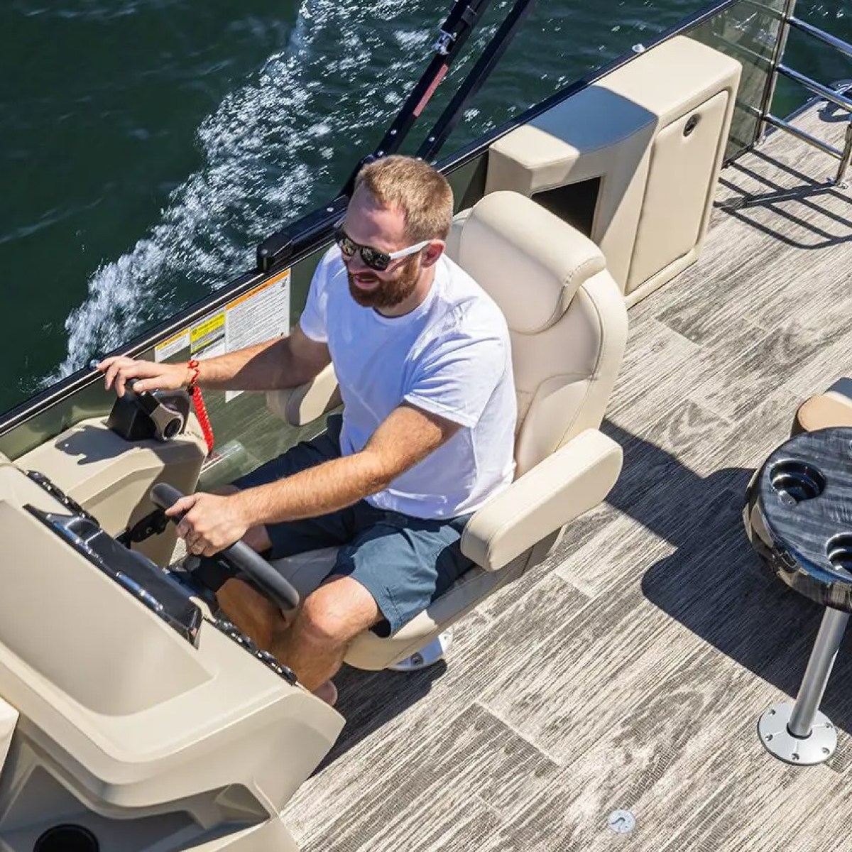 a man sitting on a boat in the water