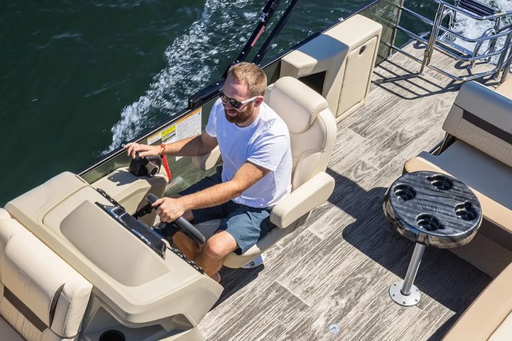 a man sitting on a boat in the water