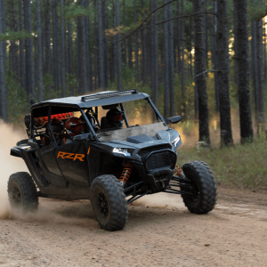 a truck driving down a dirt road