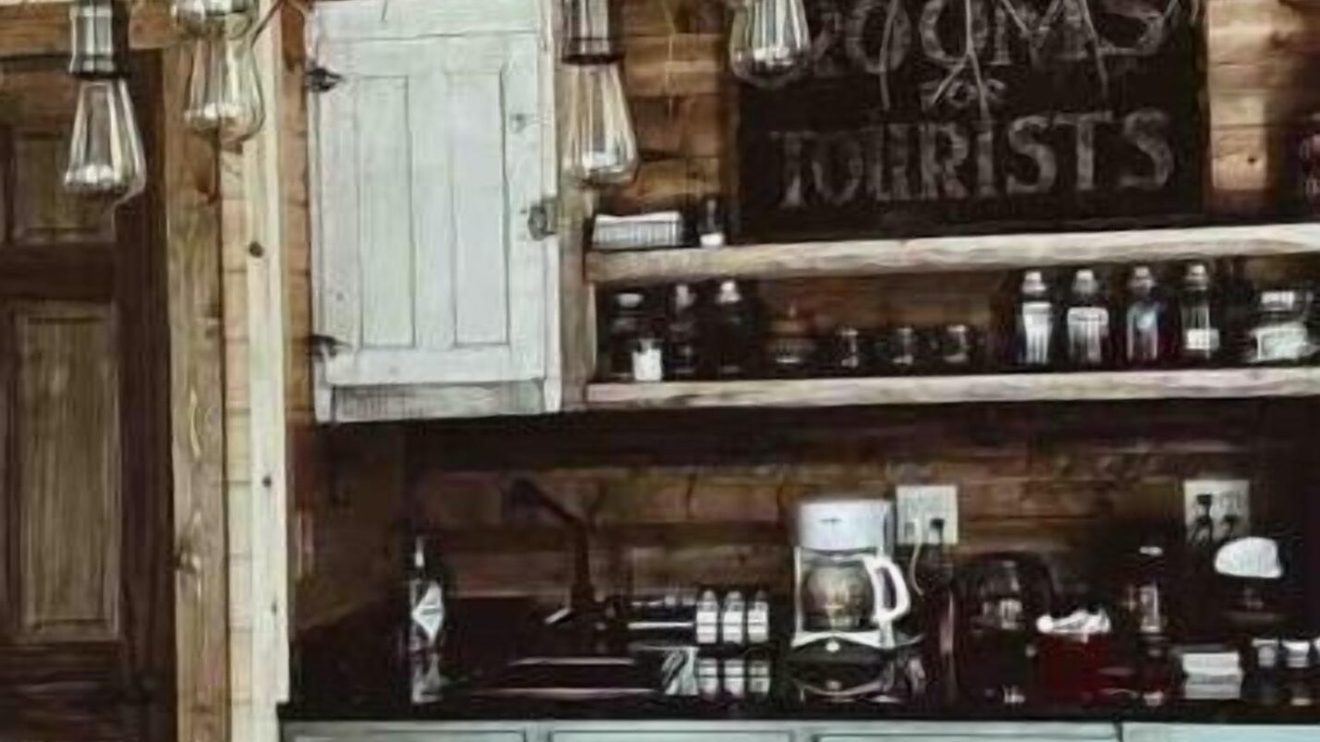 a kitchen with wooden furniture and vase on a table