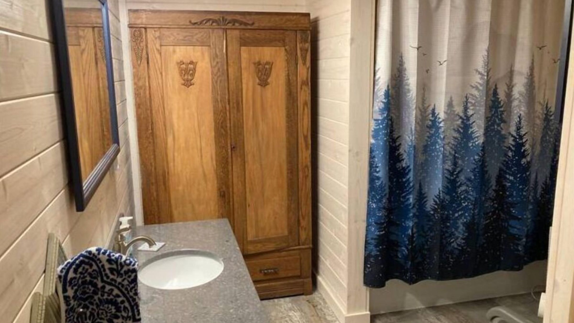 a room with a sink and a mirror