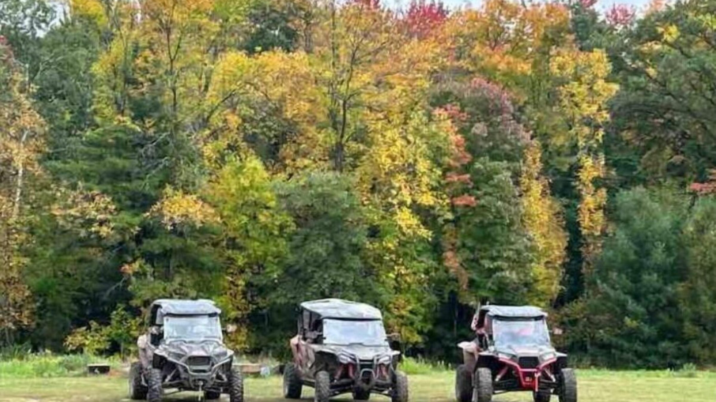 a truck driving down a dirt road
