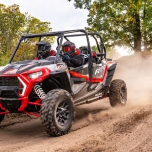 a truck driving down a dirt road