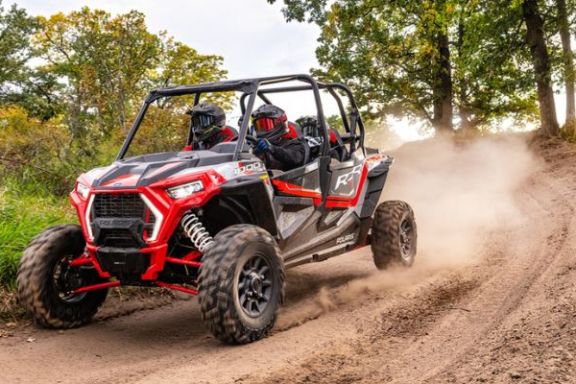 a truck driving down a dirt road
