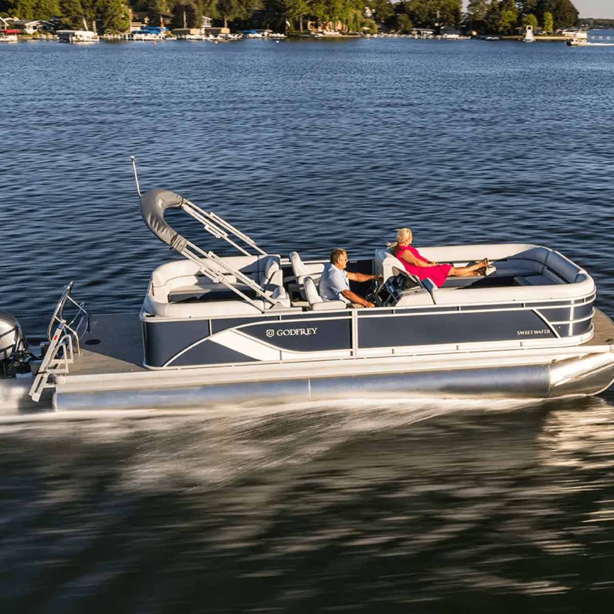 a godfrey pontoon in a body of water