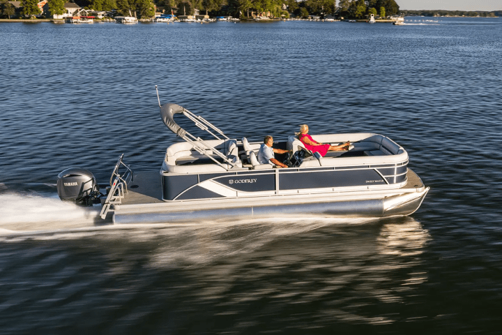 a godfrey pontoon in a body of water