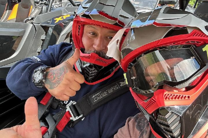 a man sitting on a motorcycle