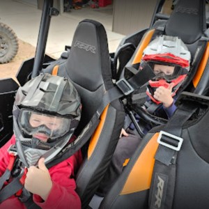 a person sitting on a motorcycle