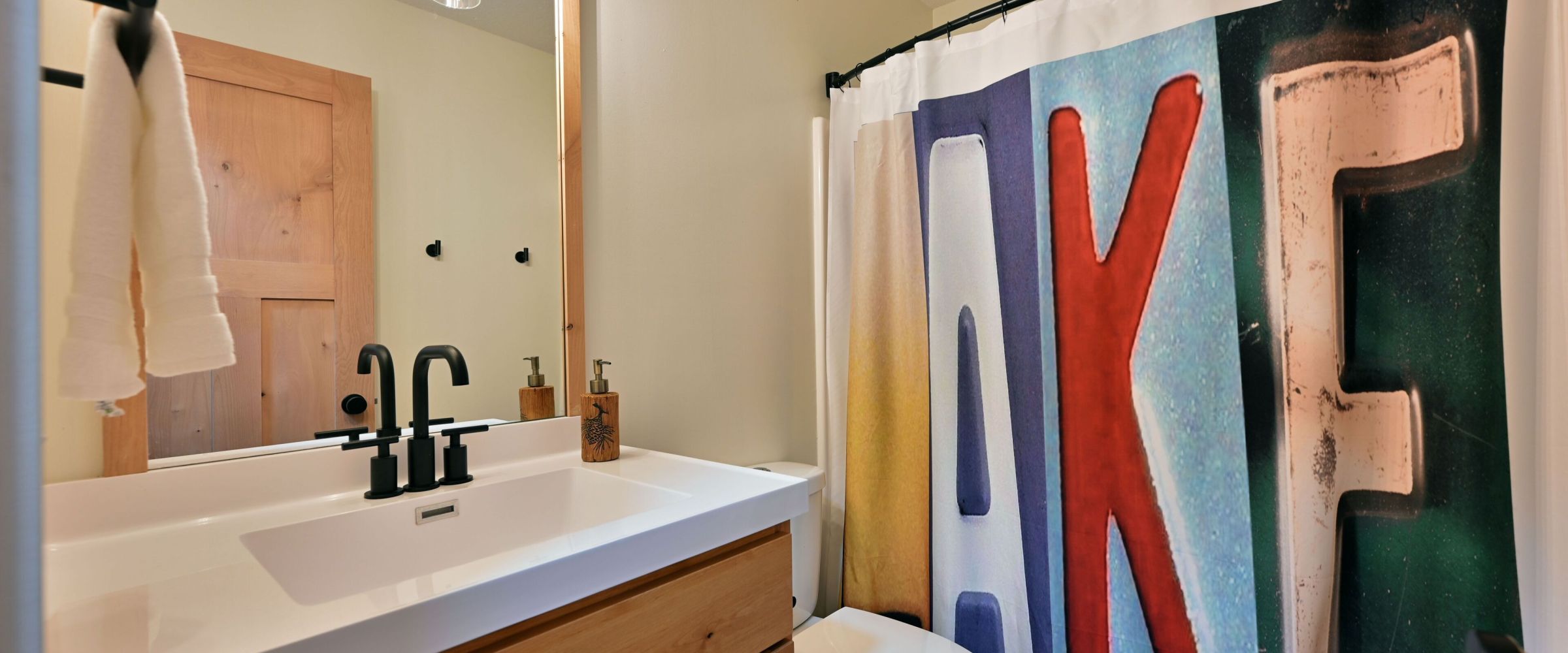 a room with a sink and a mirror