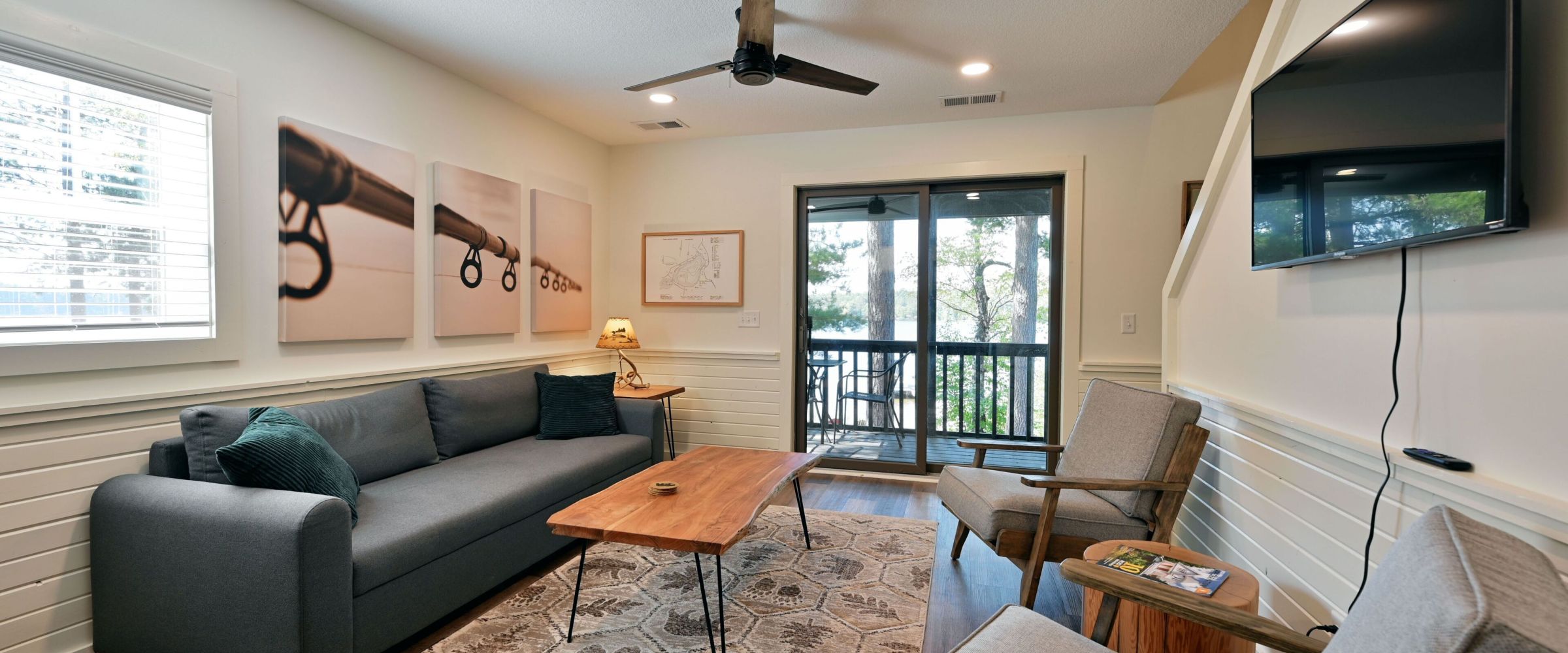 a living room filled with furniture and a large window