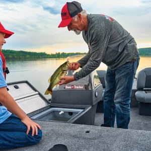 a man riding on the back of a boat