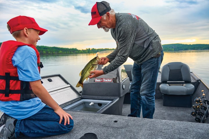 a man riding on the back of a boat