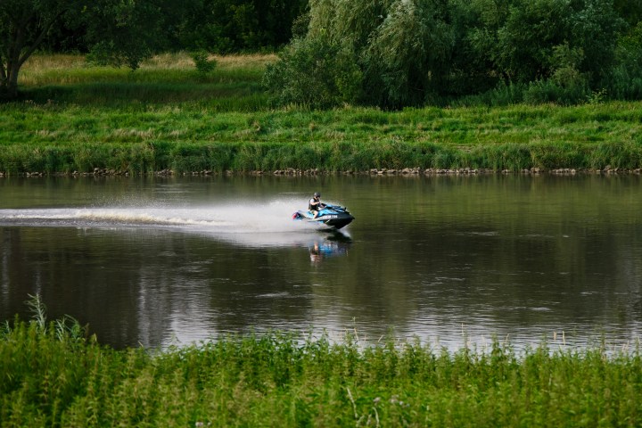 a pond next to a body of water